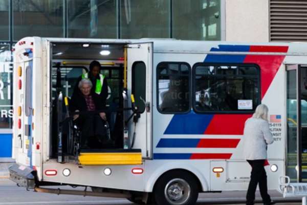 A METROLift rider offboards a vehicle.
